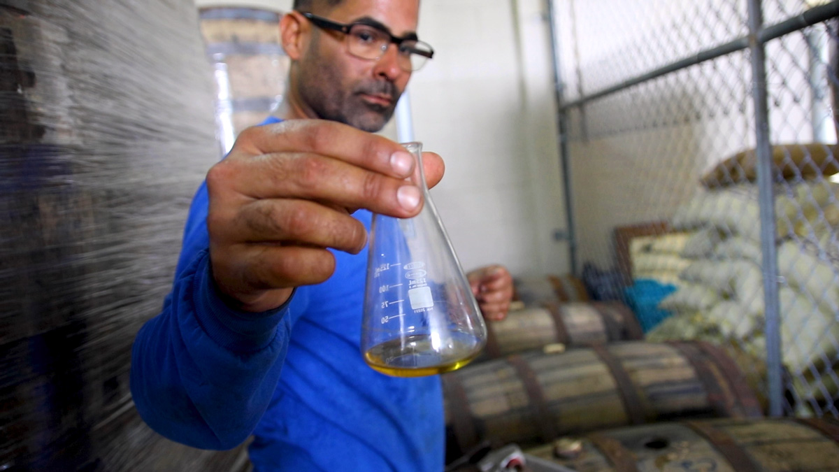 Ivan Torres Sampling Rum at the Distillery